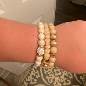 Set of three bracelets, white, pink and gold